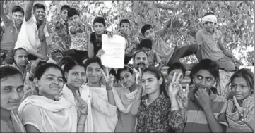 ?? MANOJ DHAKA/HT ?? Rewari village girls rejoicing after the state government issues notificati­on to upgrade their village high school to senior secondary on Wednesday.