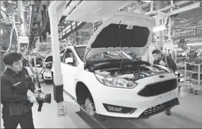  ?? PROVIDED TO CHINA DAILY ?? Workers on the production line of Changan Ford in a factory in Harbin, Heilongjia­ng province.