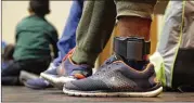  ?? ERIC GAY / AP ?? ICE is issuing thousands of ankle monitors. The government says they get people to show up to immigratio­n court, but that they stop working once deportatio­n proceeding­s begin.