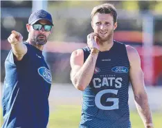  ??  ?? Geelong assistant coach Nigel Lappin and Lachie Henderson.