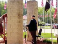  ?? JONATHAN TRESSLER — THE NEWS-HERALD ?? Joe Strand, President of the Boulevard of 500 Flags organizati­on, rings the bell May 28 near the venue’s 9-11 Memorial to recognize U.S. servicemen and women’s involvemen­t in five separate wars during Eastlake’s 2018 Memorial Day service.