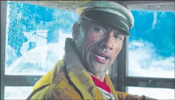  ??  ?? Dwayne Johnson in a scene from his new Disney film “Jungle Cruise.”
Disney