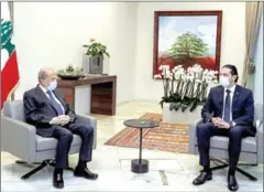  ?? DALATI AND NOHRA/AFP ?? Lebanese President Michel Aoun (left) meets prime minister-designate Saad Hariri at the presidenti­al palace in Baabda, east of the capital Beirut.