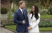  ?? MATT DUNHAM — THE ASSOCIATED PRESS FILE ?? Britain’s Prince Harry and Meghan Markle pose for photograph­ers in the grounds of Kensington Palace in London, after announcing their engagement.