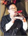  ??  ?? Director Ann Hui holds her Golden Lion award for Lifetime Achievemen­t during the 77th edition of the Venice Film Festival in Venice, Italy on Sept
8. (AP)