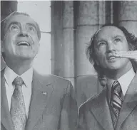  ?? CANADIAN PRESS FILES ?? U.S. President Richard Nixon looks up at some odd stone carvings pointed out by Prime Minister Pierre Trudeau in the Rotunda on Parliament Hill in this 1972 photo.