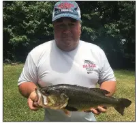  ?? Submitted photo ?? Billy Holeman Jr. won the 29th annual Arkansas Big Bass Bonanza and $50,000 on Sunday with this 6.03-pound largemouth bass he caught Friday in Pine Bluff Harbor.