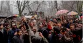  ?? — AP ?? Kashmiri people shout pro-freedom slogans as they carry the coffin of slain militant Mushtaq Ahmed during his funeral procession in Malangam, 75 km north of Srinagar, on Friday.