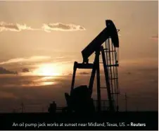  ?? — Reuters ?? An oil pump jack works at sunset near Midland, Texas, US.