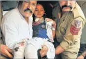  ?? AP PHOTO ?? A girl injured in Pak firing being shifted to a hospital, in RS Pura sector on Tuesday.