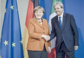  ?? EPA ?? A Berlino.Il premier Paolo Gentiloni stringe la mano alla cancellier­a tedesca Angela Merkel al termine della conferenza stampa congiunta