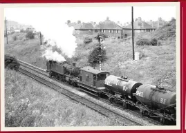  ??  ?? GWR ‘5101’ No. 4173 helps a goods train as it approaches Old Hill tunnel on the steep climb from Cradley Heath to Rowley Regis on August 30 1962. MICHAEL MENSING