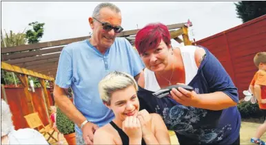  ??  ?? Mick Brooks, who has died after being crushed by his own car, pictured helping grandaught­er Lucy and her mum Tarina prepare for a sponsored headshave last summer