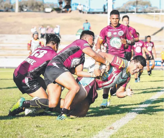  ?? Picture: QRL Media ?? Marsden High defenders attempt to hold up a Keebra Park try in yesterday’s GIO Cup Queensland decider.