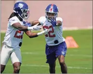  ?? Kathy Willens / Associated Press ?? New York Giants cornerback Adoree’ Jackson, right, fends off cornerback Logan Ryan, left, as they go through a drill during an NFL practice on Thursday in East Rutherford, N.J. Jackson’s addition to the Giants’ secondary could be a key addition.