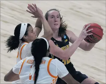  ?? CHARLIE RIEDEL — THE ASSOCIATED PRESS ?? Michigan’s Leigha Brown shoots under pressure from Tennessee’s Rae Burrell, back right, and Kasiyahna Kushkituah.