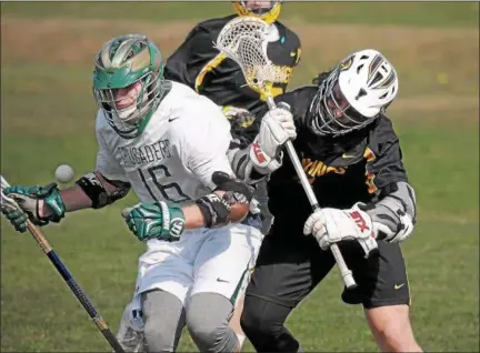  ?? GENE WALSH — DIGITAL FIRST MEDIA ?? Archbishop Wood’s Colin Bruestle knocks the ball from the control of Lansdale Catholic’s Jason Doheny defends Wednesday.