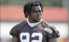  ?? PHOTO/RON SCHWANE ?? In this Aug. 14, 2018, file photo, Cleveland Browns defensive end Chad Thomas walks out to the field during NFL football training camp in Berea, Ohio. AP