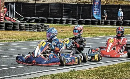  ?? Picture: MOTORSPORT FANATIX ?? TIGHT RACE: Josh Coertze (No 61) is put under pressure by Keagan Masters (No 18) during their battle at the Vereenigin­g Kart Club, with Carlo Oliver close behind