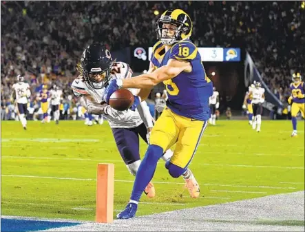  ?? Photograph­s by Wally Skalij Los Angeles Times ?? COOPER KUPP, held without a catch last week, almost scores on a 50-yard pass in the second quarter, but Bears defensive back Buster Skrine pokes the ball free at the last moment. However, the Rams retained possession, and Todd Gurley scored from one yard.