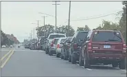  ?? MORNING SUN FILE PHOTO ?? Cars line up on High Street to the entrance to the Strickler Center in July for a contactles­s food distributi­on by the Compassion­ate Care Network. The Saginaw Chippewa Indian Tribe is giving away food from 11a.m. until 1p.m. at the Black Elk Building on the reservatio­n on Saturday.