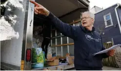  ?? Associated Press ?? Mark Andersen, 60, co-director of the non-profit organisati­on, ‘We Are Family DC,’ organises groceries and food to be brought to seniors in Washington.