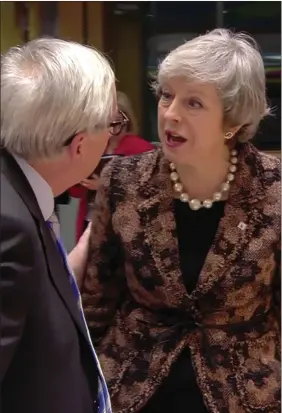  ??  ?? „ A clearly angry Theresa May confronts Commission President Jean-claude Juncker.