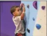  ?? ERIC BONZAR — THE MORNING JOURNAL ?? Four-year-old Brayden Small climbs the Rock Werx rock climbing wall Nov. 29.