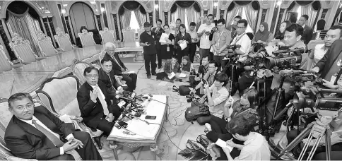  ??  ?? Abang Johari (seated, second left) addressing a packed press conference at his office in Wisma Bapa Malaysia. — Photo by Chimon Upon