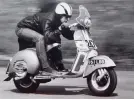  ?? ?? Boss Martin Pagett (blue shirt) and his loves: classic cars (this is his Roadster) and bikes.