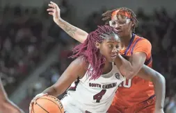  ?? SEAN RAYFORD/AP ?? South Carolina forward Aliyah Boston, left, drives against Clemson center LaTrese Saine during the first half Wednesday in Columbia, S.C.