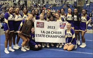  ?? Contribute­d photo ?? Dragon fire: Junction City's cheerleade­rs celebrate after winning the 1A-2A State Cheer Championsh­ip on Friday in Hot Springs.