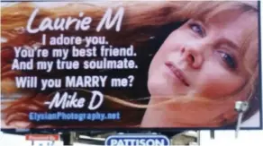  ?? Mike Dagenais /THe CanaDian PRess ?? Mike Dagenais posted a photograph of girlfriend Laurie Moring on a digital billboard a few days ago as part of a marriage proposal plan that fell in place on Valentine’s Day.
