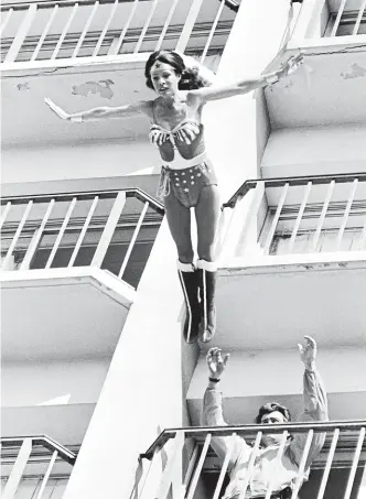  ?? GETTY ?? Kitty O’neil as Wonder Woman, jumping from a building in Los Angeles. In one stunt for the TV show, she fell a record 38 metres on to an inflated airbag below. ‘‘If I hadn’t hit the centre of the bag, I probably would have been killed,’’ she said.