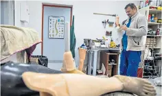  ?? ?? Technician Anton Persianov in his workshop, where most prosthetic­s are out of date