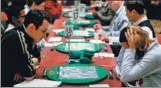  ?? AP ?? Competitor­s take part in the World Scrabble Championsh­ips in London on Nov 17. The tournament has taken place every two years since 1991.