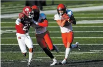  ?? ADAM HUNGER THE ASSOCIATED PRESS FILE PHOTO ?? Illinois running back Chase Brown, right, rushes past Rutgers defensive back Tre Avery during the second half of an NCAA football game last Saturday in Piscataway, N.J. The five-foot-11, 195-pound Brown, from London, Ont., ran for a career-high 131 yards on 17 carries in a 23-20 Illinois victory.