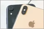  ?? RICHARD DREW—THE ASSOCIATED PRESS ?? The new iPhone XR, which went on sale Monday starts at $749. Two months of XR revenue will be included in Apple’s holiday quarter.