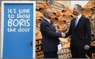  ?? (AP/PA/Andrew Matthews) ?? Liberal Democrat Leader Ed Davey (left) celebrates with Richard Foord, the newly-elected Liberal Democrat lawmaker for Tiverton and Honiton on Friday in Crediton, England.