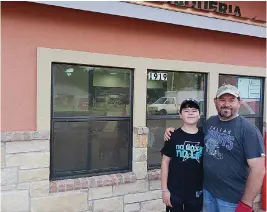  ?? Staff photo by Junius Stone ?? ■ Cristino Rubacaba, right, and his son, Christophe­r, are preparing to open Los Abuelos Meat Market & Taqueria in mid-May. The grocery and deli is at 1919 N. Robison Road.