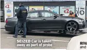  ??  ?? SEIZED Car is taken away as part of probe