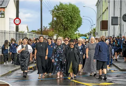  ?? CATHERINE GROENESTEI­N/STUFF ANDY MACDONALD/STUFF ?? Te Paepae o Aotea in Hāwera opened on February 1 with a pōwhiri. Māori Party co-leader Debbie Ngarewa-Packer (left) and Te Paepae O Aotea tumuaki Rachel Williams (centre) move with the women to be welcomed to the new school.
Margie Carswell, who organised a petition, speaks against the road closure proposal at the council meeting on January 31. (File photo)