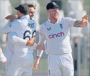  ?? ?? Will Jacks (centre) celebrates with Joe Root and Ben Stokes after taking the wicket of Pakistan’s Abdullah Shafique yesterday