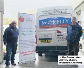  ??  ?? > Alan Dunne takes delivery of game meat from Andy Gray