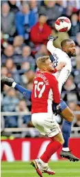  ?? ?? Tanguy Ndombele (R) in action with Morecambe’s Shane Mcloughlin