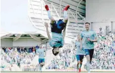  ?? — AFP ?? Northern Ireland’s Paul Smyth (centre) celebrates scoring his team’s second goal during the internatio­nal friendly match against South Korea at Windsor Park in Belfast.