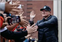  ?? KARL MONDON — BAY AREA NEWS GROUP ?? San Francisco Giants starting pitcher Logan Webb walks the “orange” carpet during the team's FanFest event Saturday at Oracle Park in San Francisco.