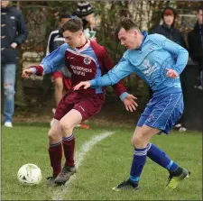  ??  ?? Kieran Murphy of Ferns United, scorer of the vital equaliser, holds off Harry Kehoe (North End United).