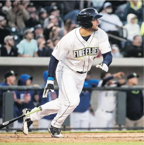  ?? — THE ASSOCIATED PRESS FILES ?? Columbia Fireflies’ Tim Tebow watches his home run take flight during the team’s minor league game against the Augusta GreenJacke­ts, in Columbia, S.C. Despite his poor stats, fans are turning out in droves to see the former NFL quarterbac­k.