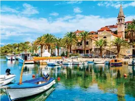  ??  ?? PEACEFUL: Palm trees line Splitska harbour on the island of Brac